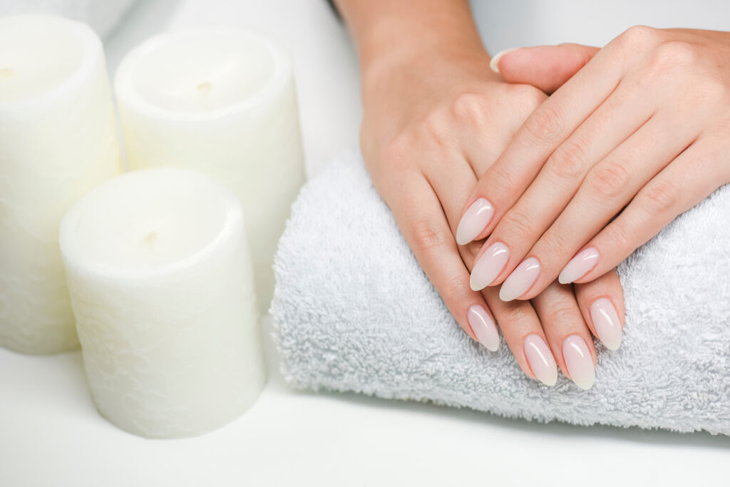 Top care manicure. Woman hands care and relaxing.  Nails salon